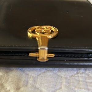 Vintage Gucci wallet. Black leather with gold double g’s